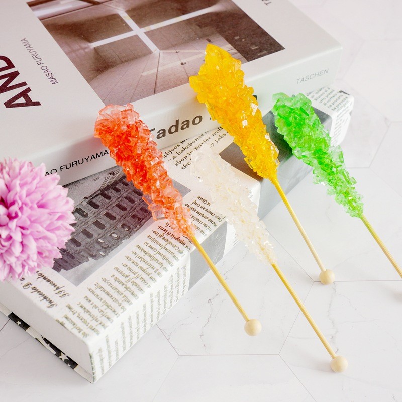 Brown Sugar Lollipop with Fruity Flavor Hard Texture Coated Icing and Cartoon Pattern Packaged in Boxes and Bags