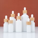 White Glass Essential Oil Bottle Factory - OEM 5-100ml Uv Coating with Gold Lid