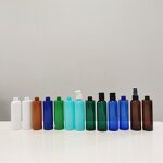 Plastic Bottles Manufacturer - OEM/ODM Custom Green PET Cosmo Rounds with Smooth Black Disc Top Caps 250ml