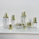 Skincare Bottles Manufacturer - Transparent Glass with Gold Cap 30g to 120g for Cream & OEM