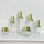 Skincare Bottles Manufacturer - Transparent Glass with Gold Cap 30g to 120g for Cream & OEM