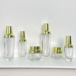 Skincare Bottles Manufacturer - Transparent Glass with Gold Cap 30g to 120g for Cream & OEM