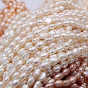 Pearl Necklace - Manufacturer 4-10MM White Nucleated Baroque Freshwater