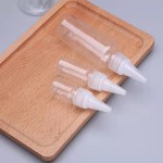 口袋挤压瓶工厂-PET尖头护发油喷嘴透明白色蜂蜜瓶